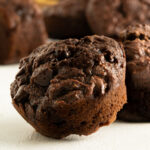 A close up of a chocolate banana muffin.