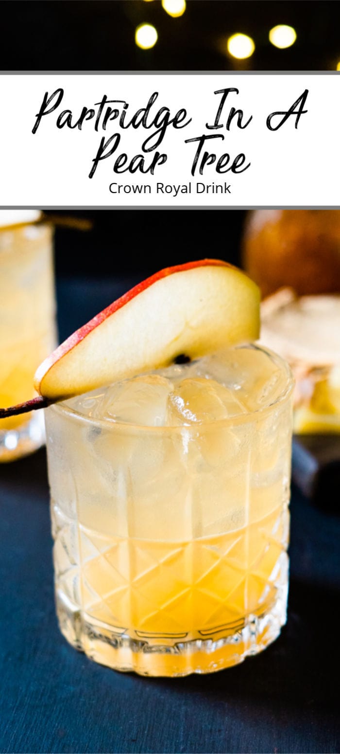 Pinterest pin of a whiskey cocktail decorated with a pear slice on a black table with holiday decorations and food