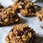 A close up of a oatmeal banana chocolate chip cookie