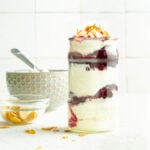 A fruit yogurt parfait in a tall jar.