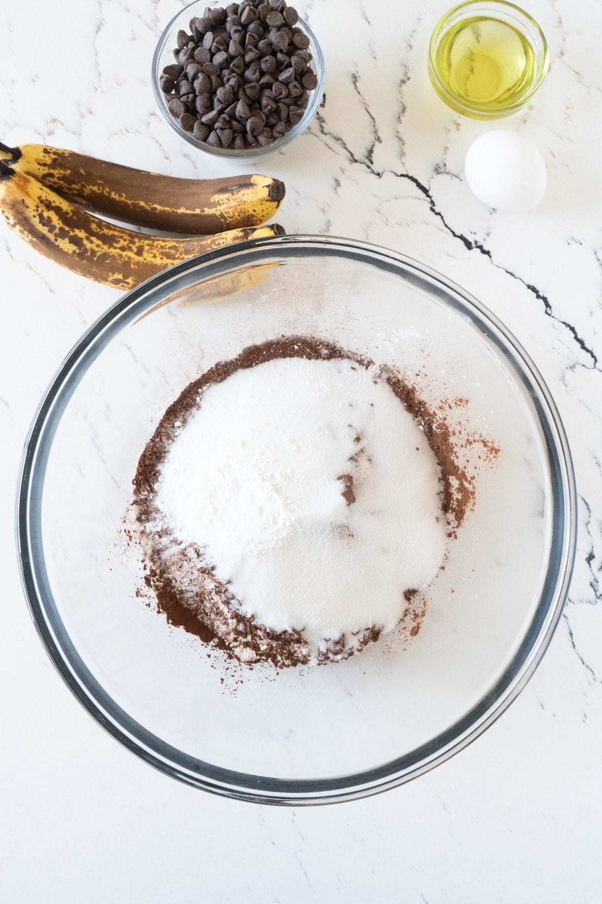 A bowl of flour, cocoa powder and sugar.