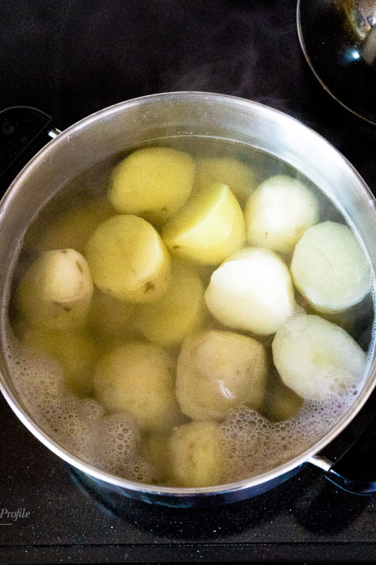 A pot of potatoes boiling.