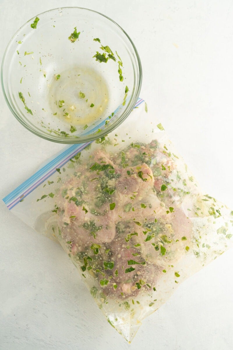 Pork chops and marinade in a resealable bag.