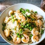 Overhead bowl of a spicy shrimp recipe with pasta and peas