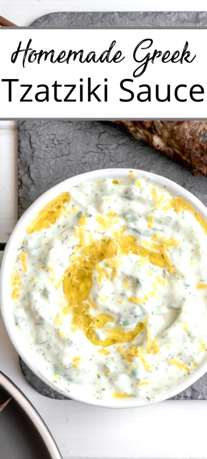 A close up of a white bowl filled with homemade tzatziki sauce and drizzled with olive oil