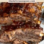 Pinterest pin showing some BBQ baby back ribs.