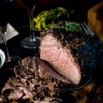 Sliced roast beef on a cutting board