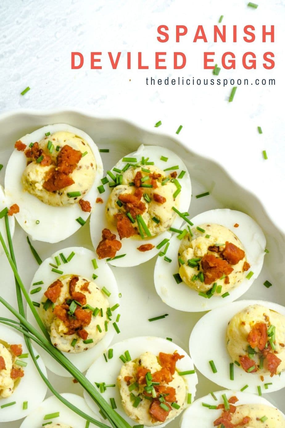 A pinterest pin showing some devilled eggs topped with chives