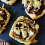 Mushroom tarts baked and topped with cheese and honey
