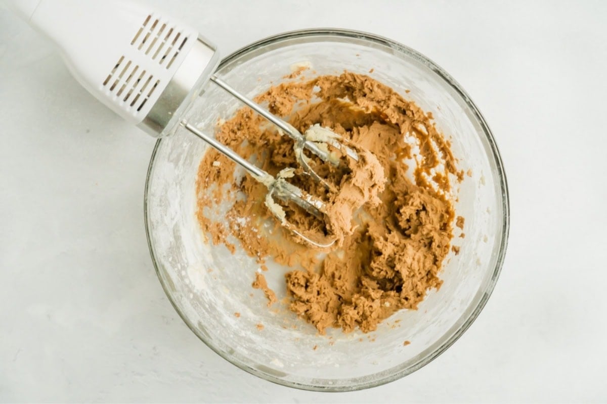 A bowl of chocolate cookie batter.