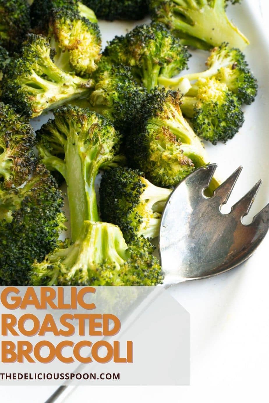 Baked broccoli on a white platter.