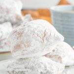 A stack of two New Orleans Style Beignets on a plate