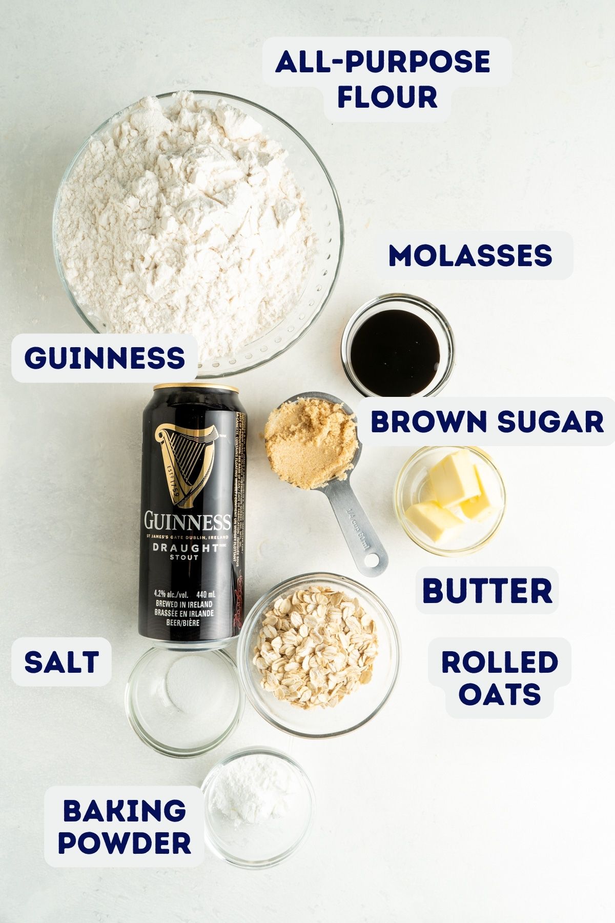 Ingredients for Guinness beer bread on a white table.
