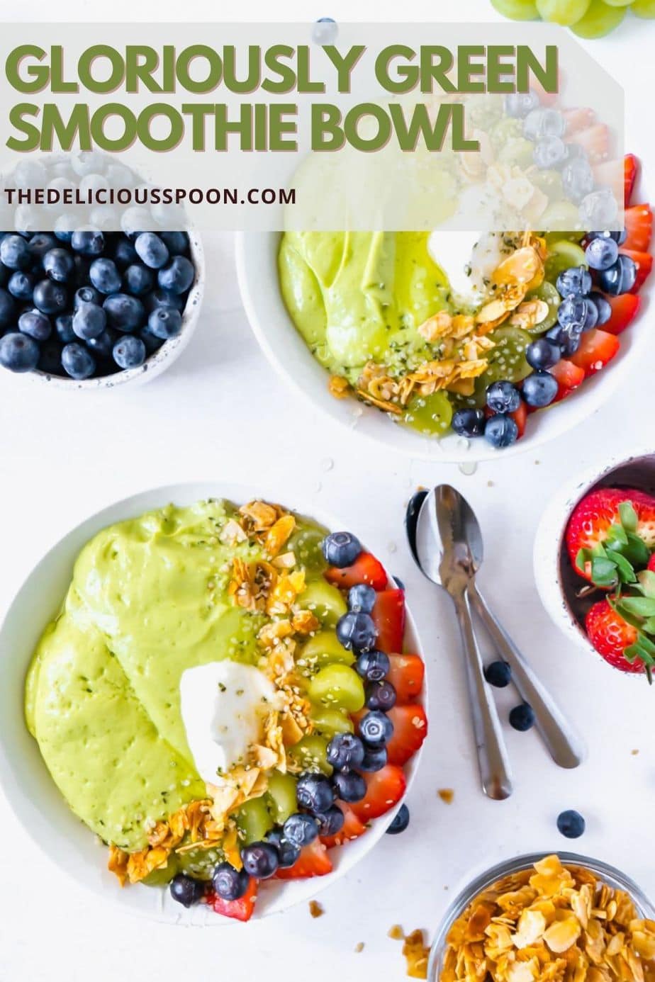A pinterest pin showing two smoothie bowls made with spinach and topped with berries and honeyed almonds.