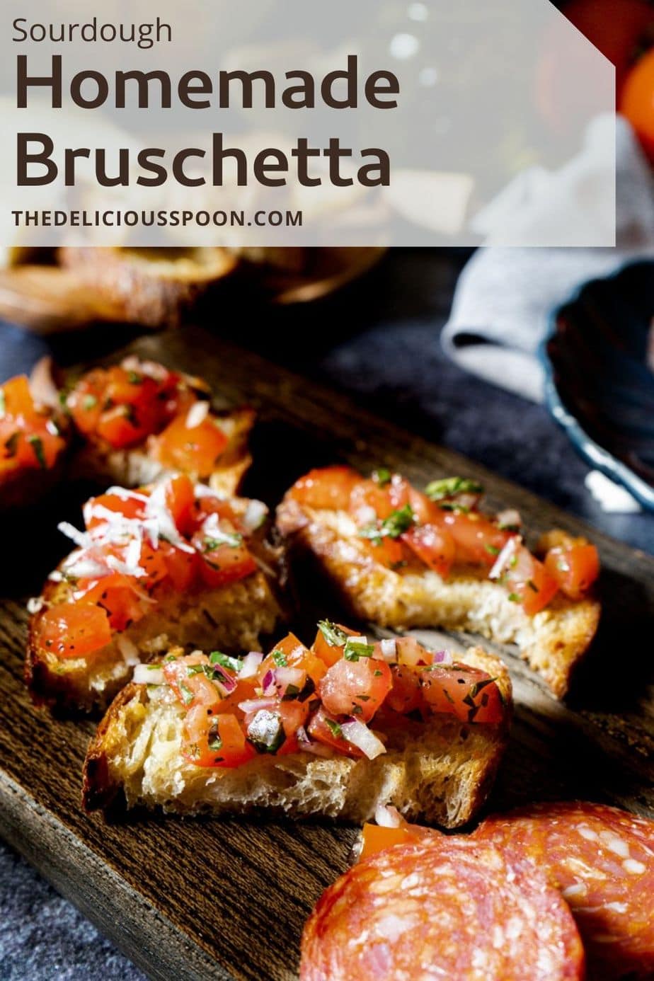 Pinterest pin showing a cutting board with three slices of and Italian Bruschetta Recipe.