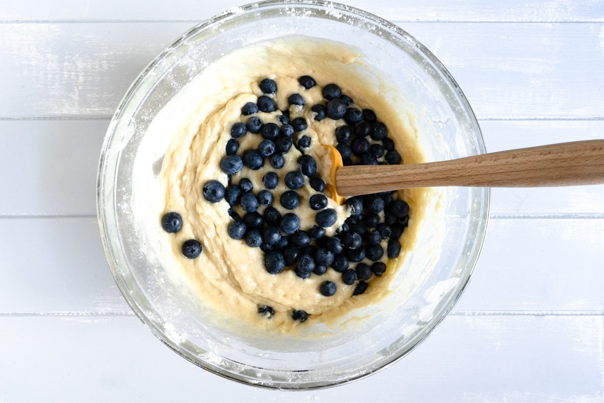 Muffin batter with blueberries.