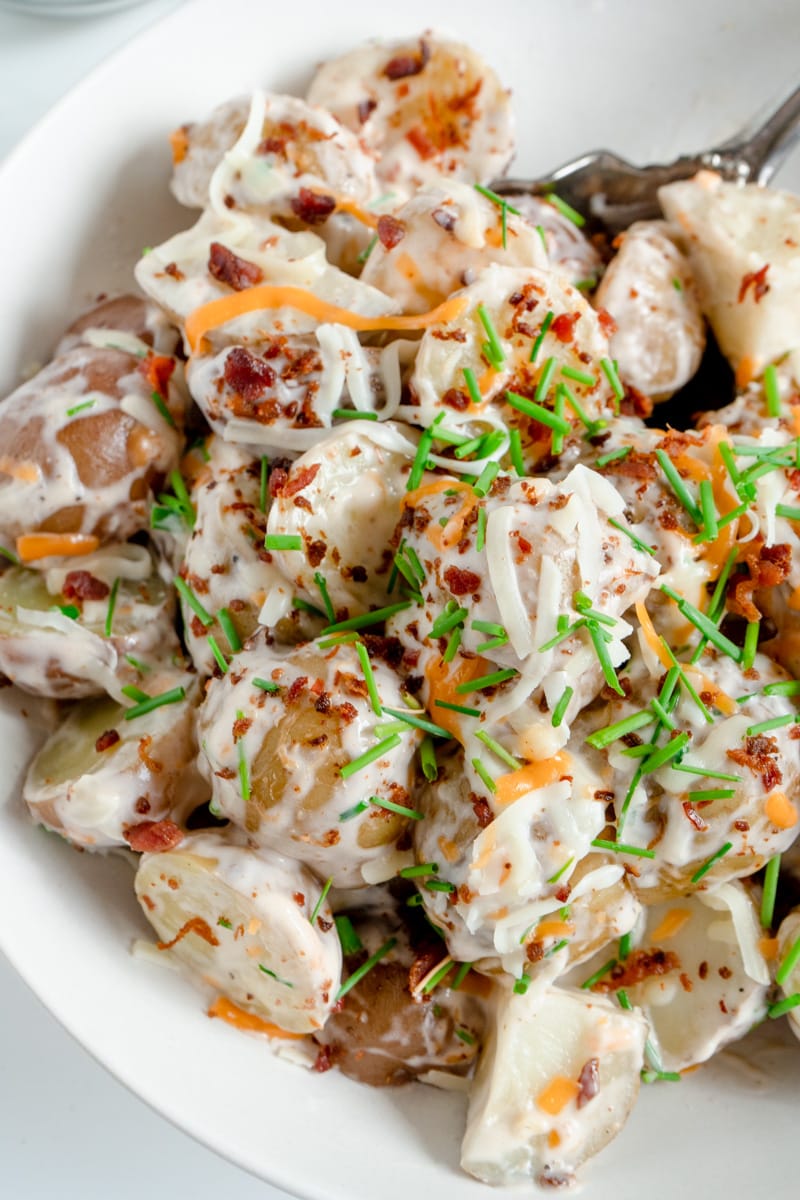 A close up of a warm potato salad recipe