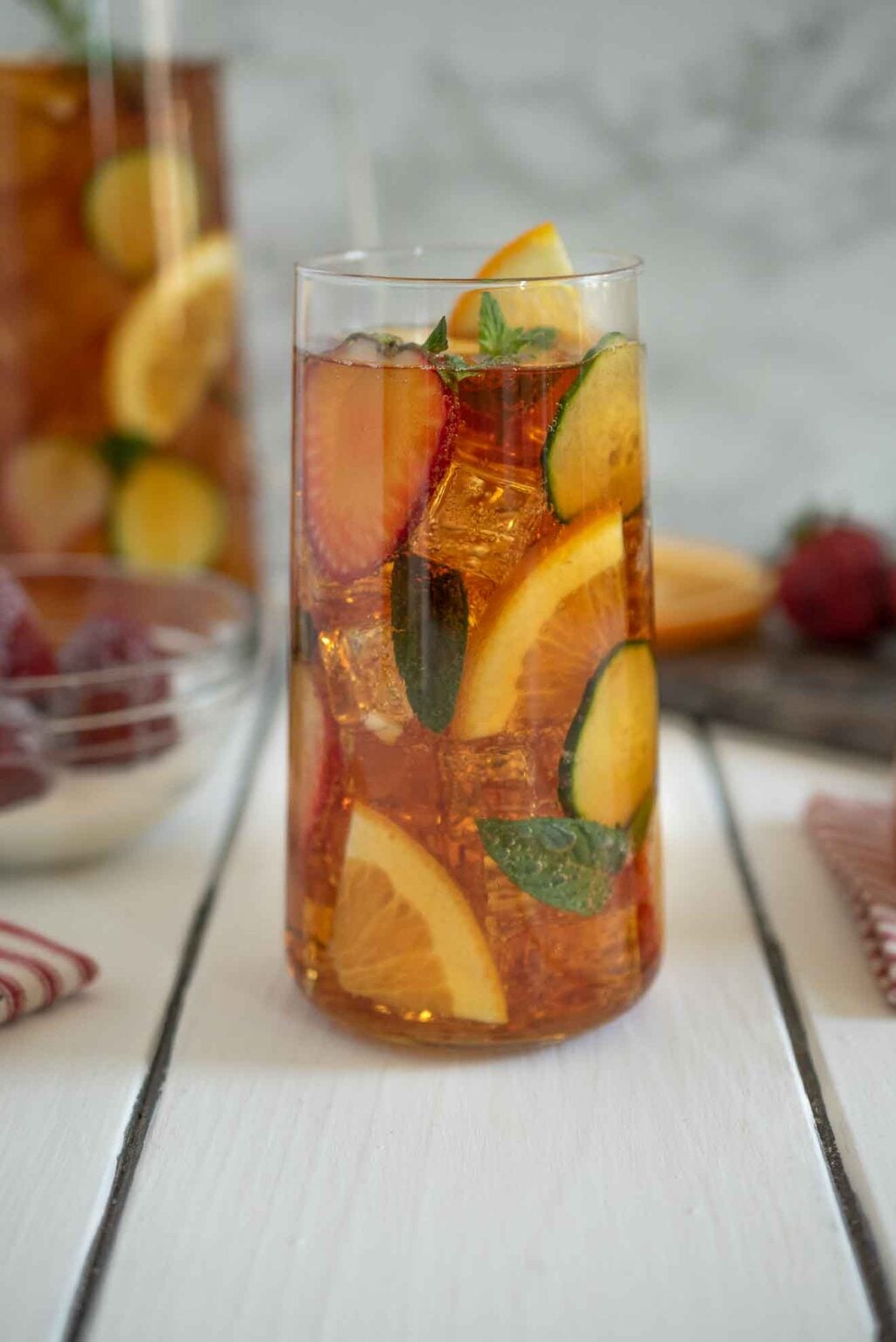 A Pimms Cocktail with orange slices.