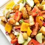 A platter filled with an Italian Panzanella Salad
