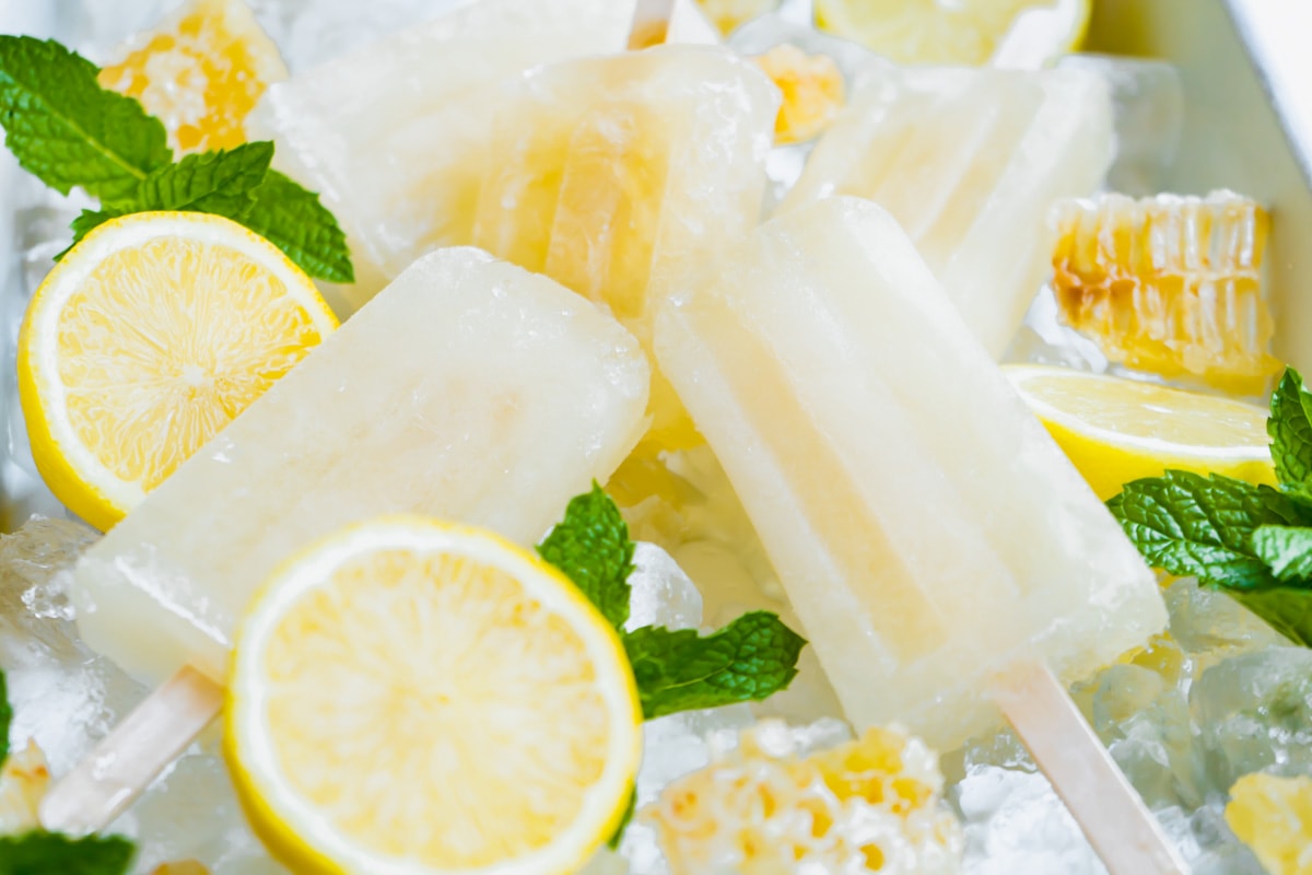 Homemade cough remedy popsicles on a bed of ice.