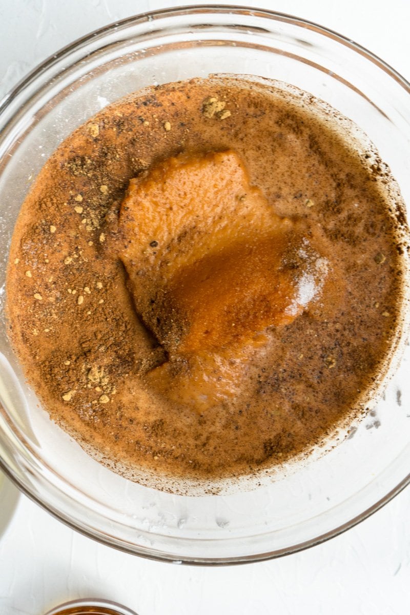 Pumpkin pie filling ingredients in a bowl.