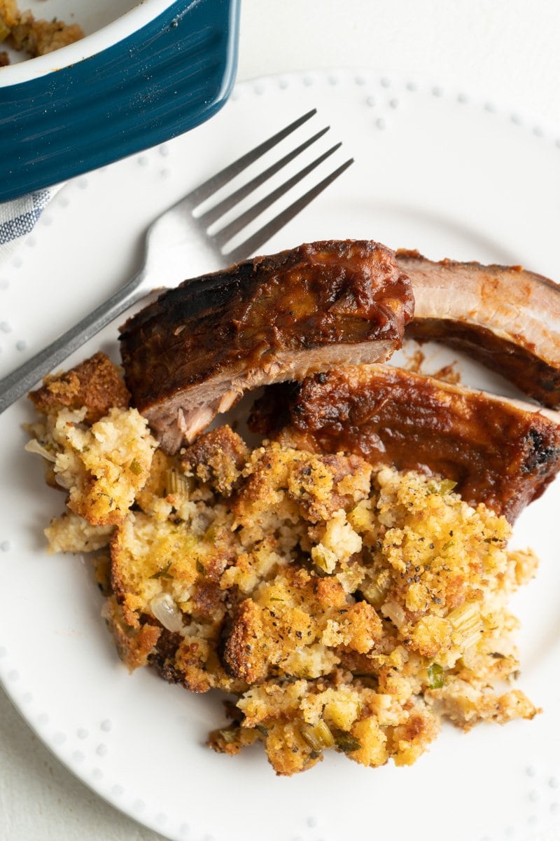 A plate of ribs and a cornbread stuffing recipe.
