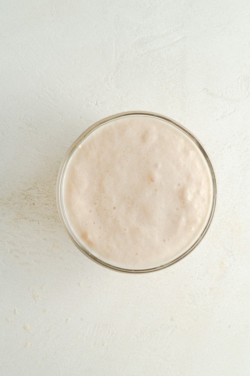 Yeast blooming in a small bowl for bread dough.