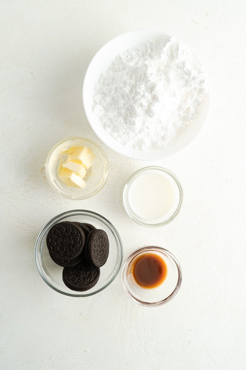 Ingredients for cinnamon roll frosting with Oreo cookies.