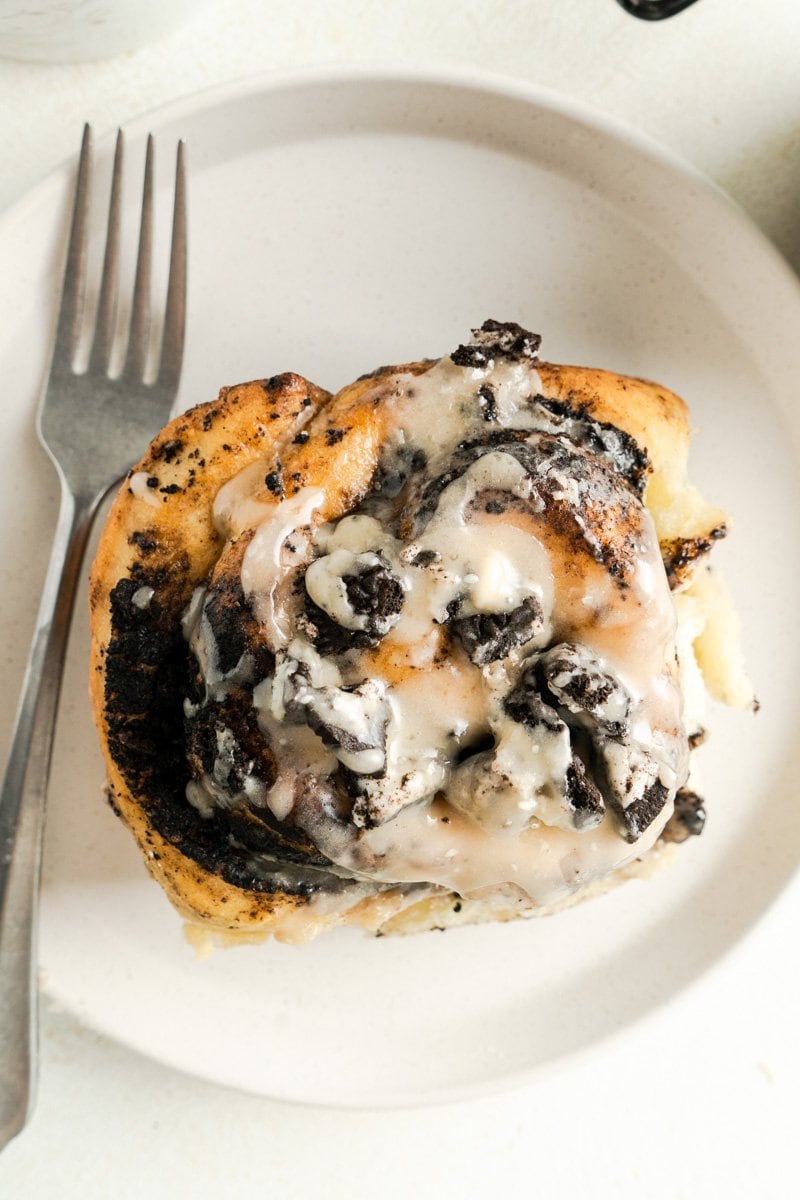 a large Oreo cinnamon bun with a fork.