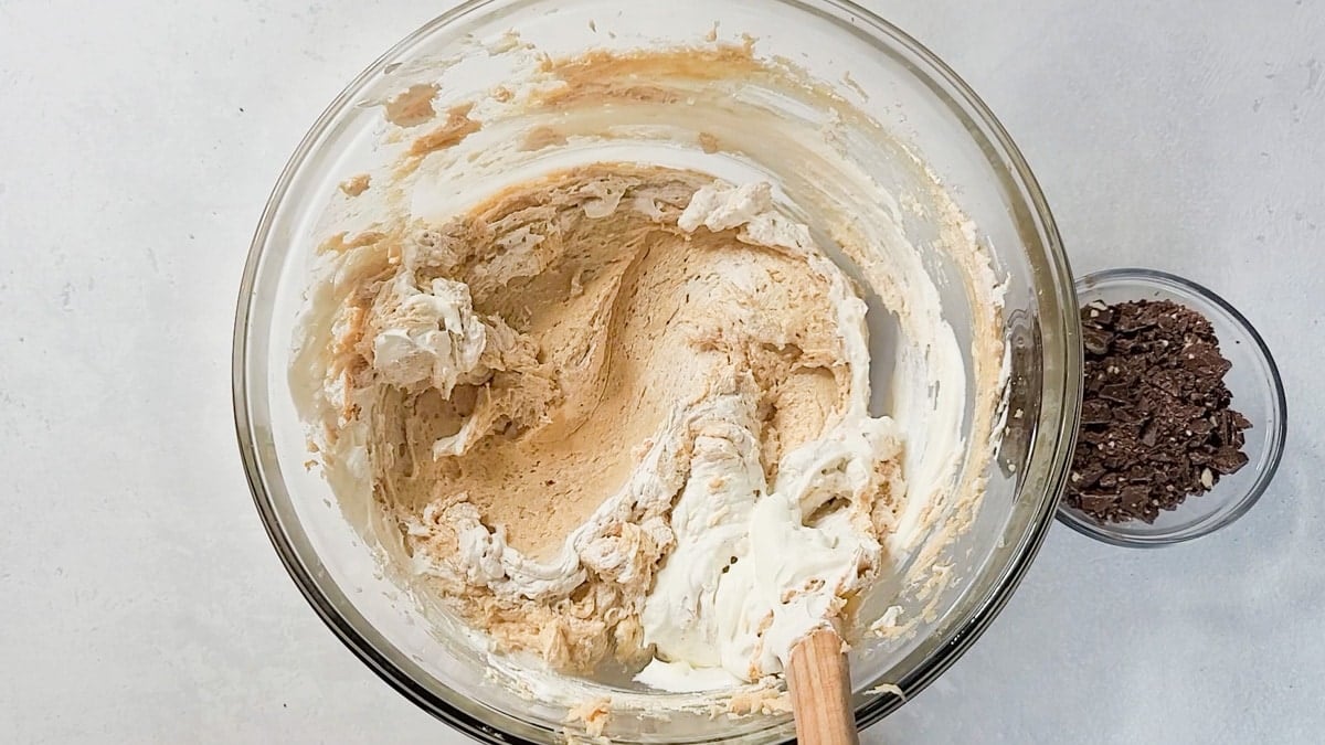 Cheesecake filling made with Cool Whip in a bowl.