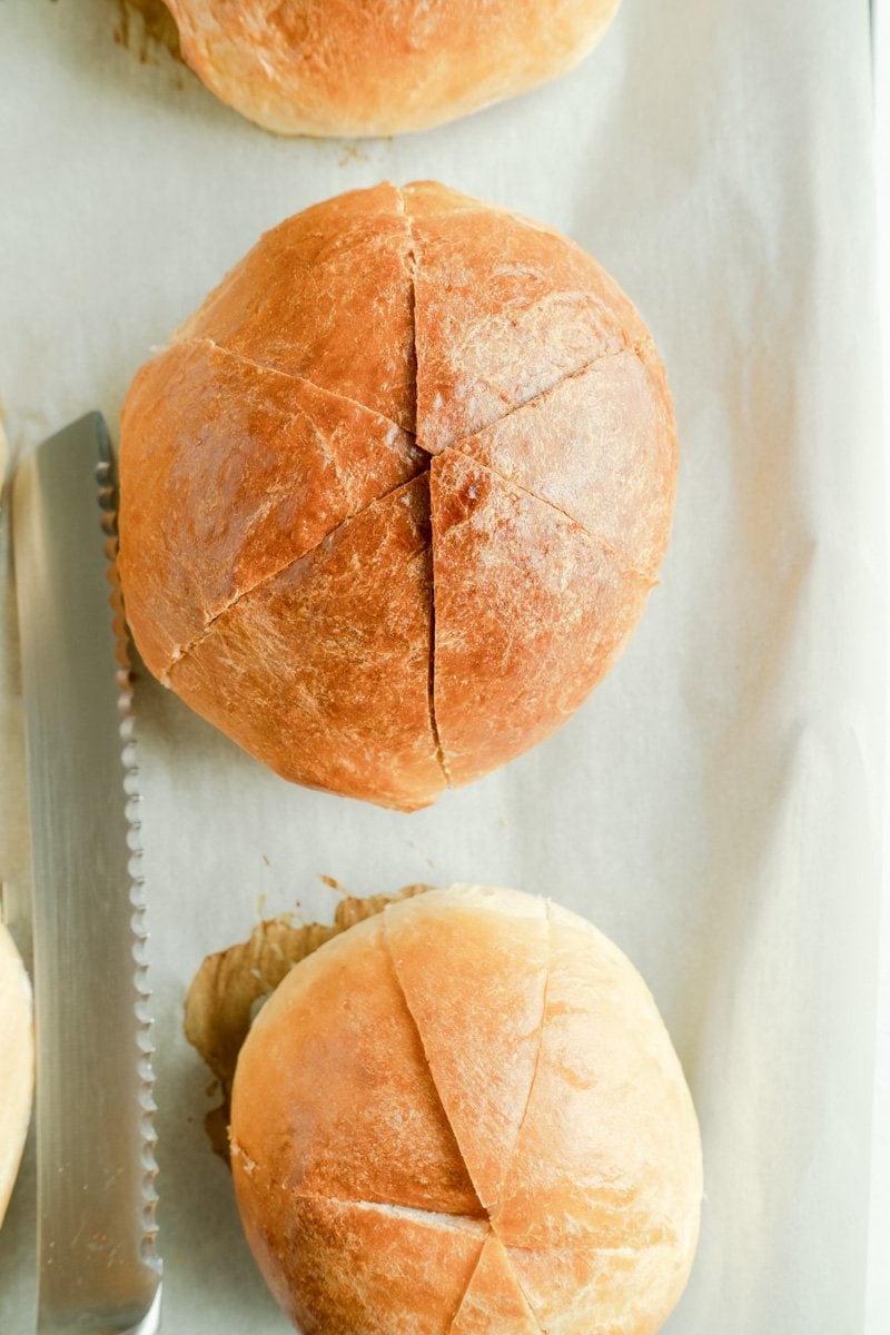 Baked buns partially cut into 6 slices on the top.