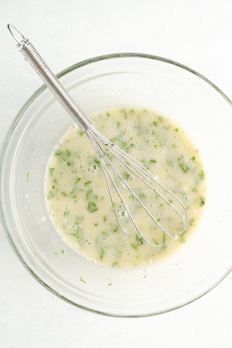 Korean Garlic Bread Coating in a bowl with a whisk.