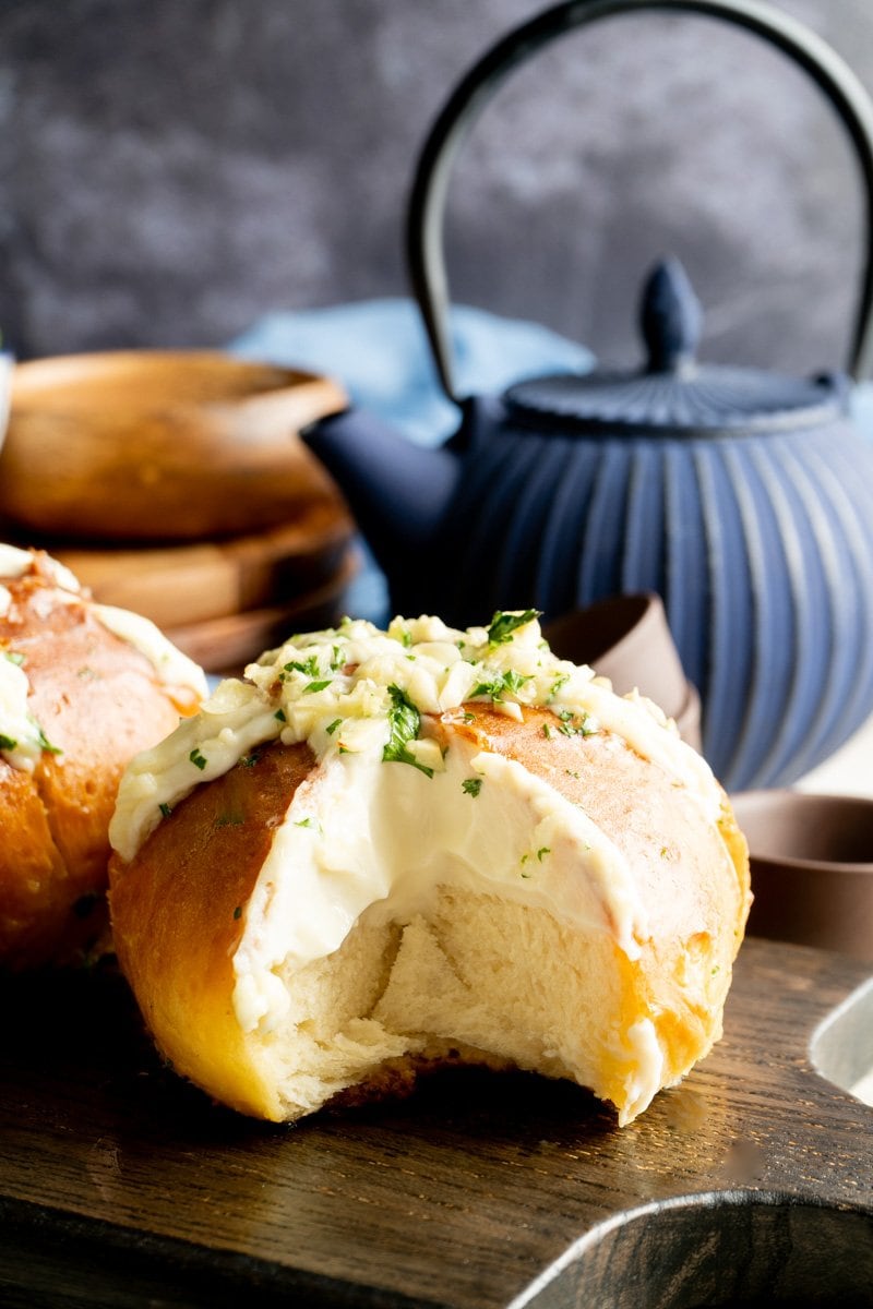 A Korean Garlic Cheese Bread with a slice removed.