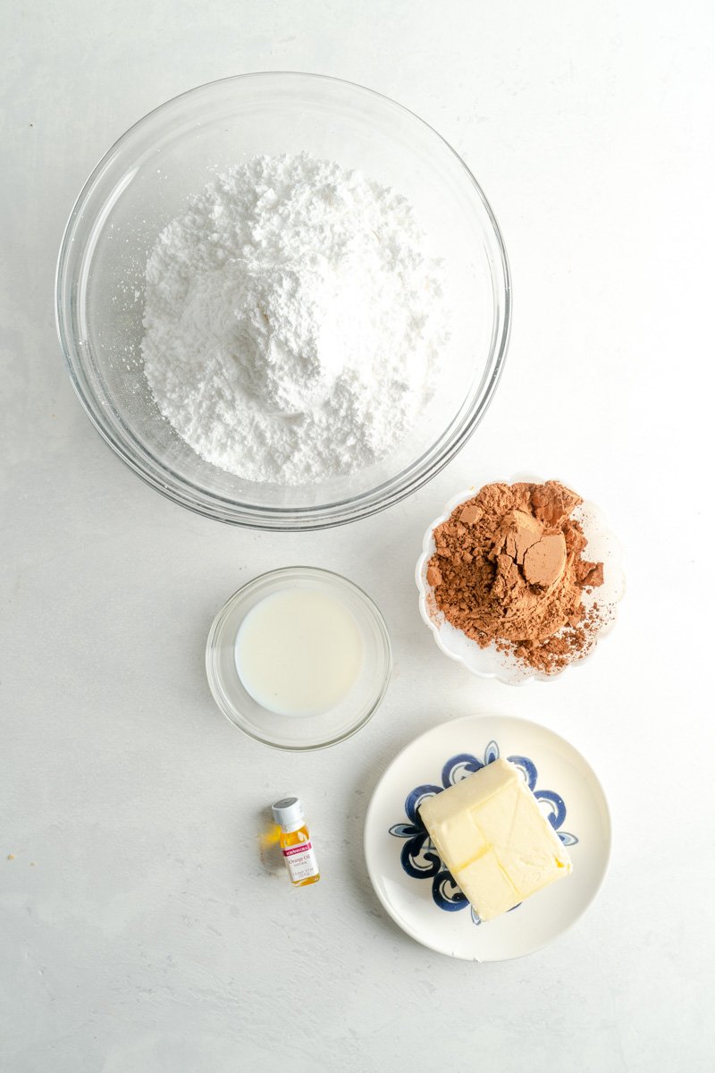 Buttercream ingredients for an orange cake.