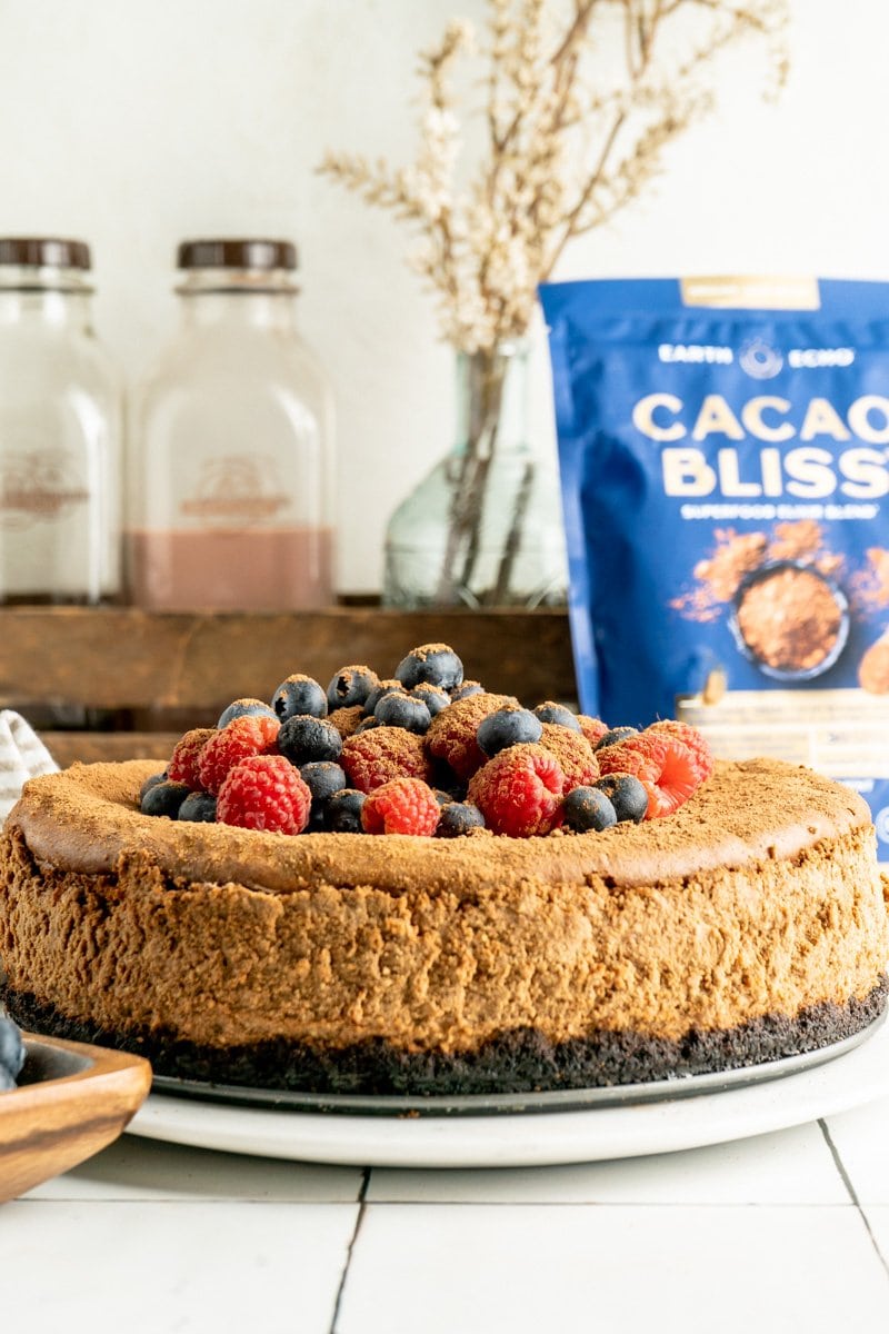 Chocolate ricotta cheesecake covered in berries.