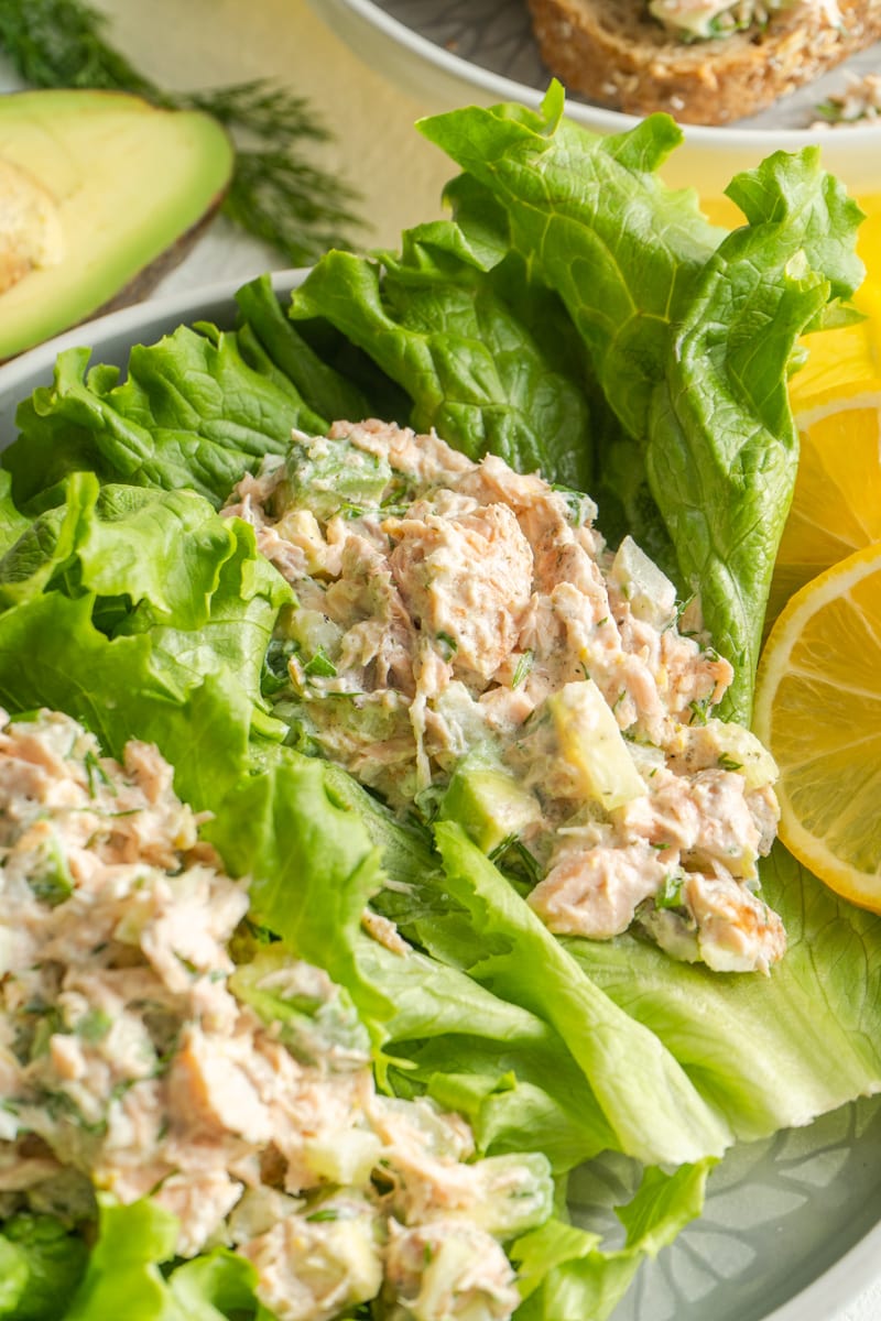 A salmon salad recipe served on lettuce leaves.