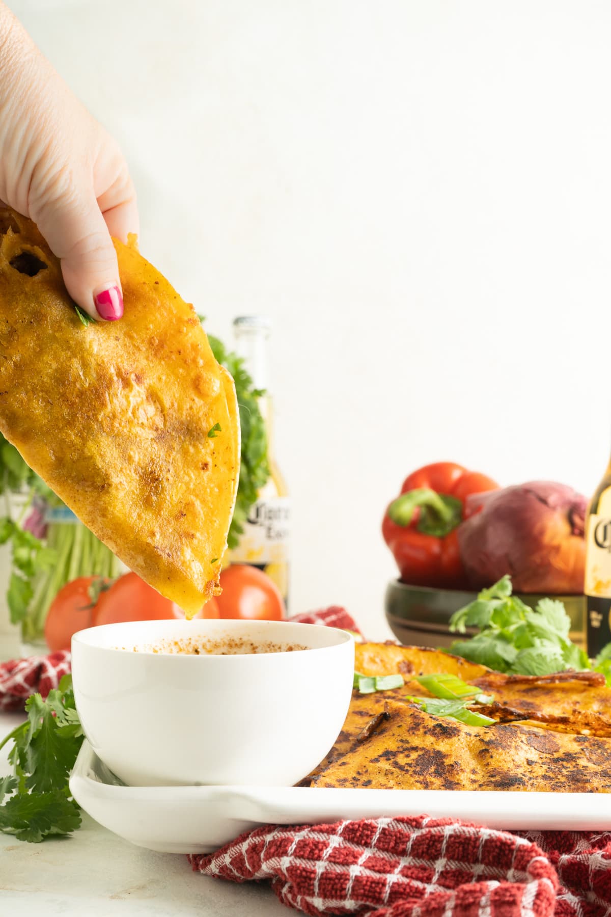Beef birria tacos on a platter.