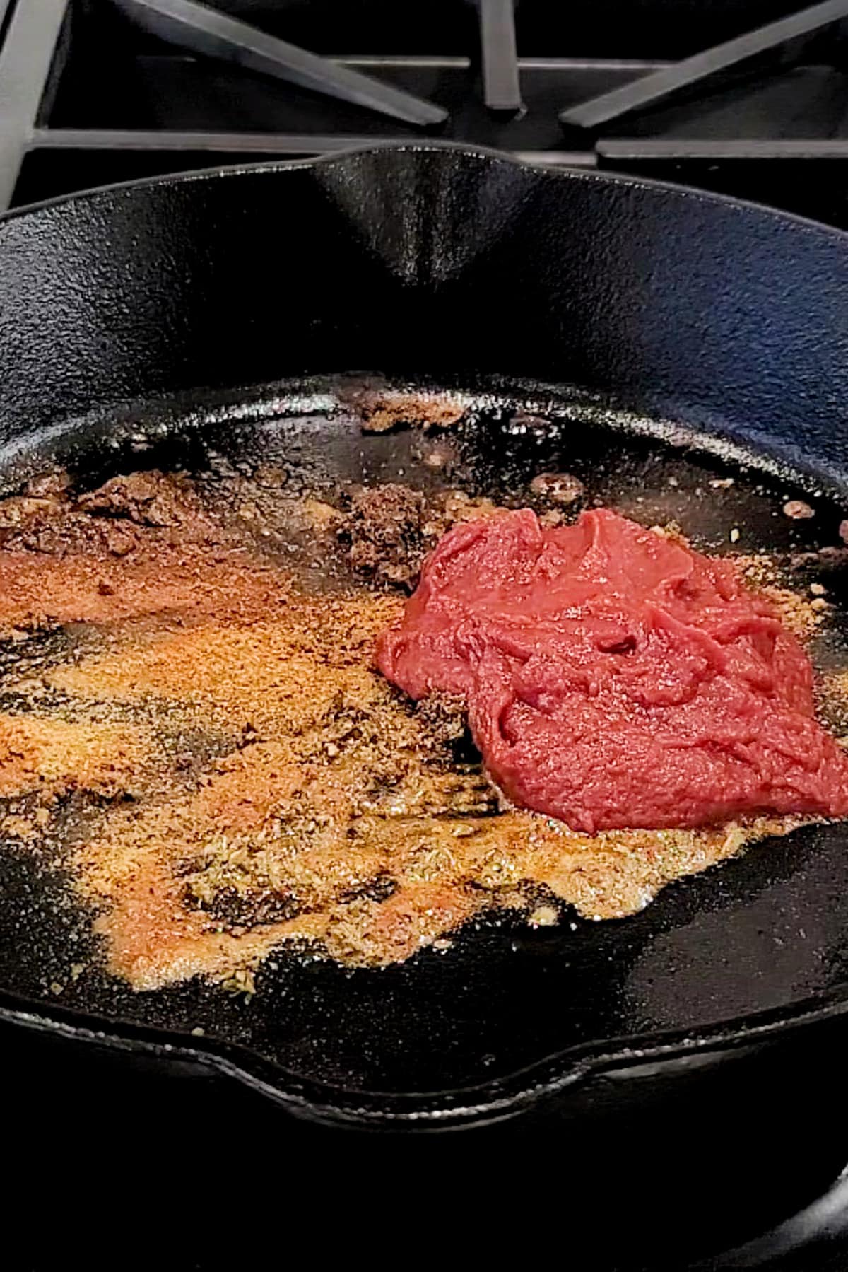 Spices for a birria taco recipe in a pan.