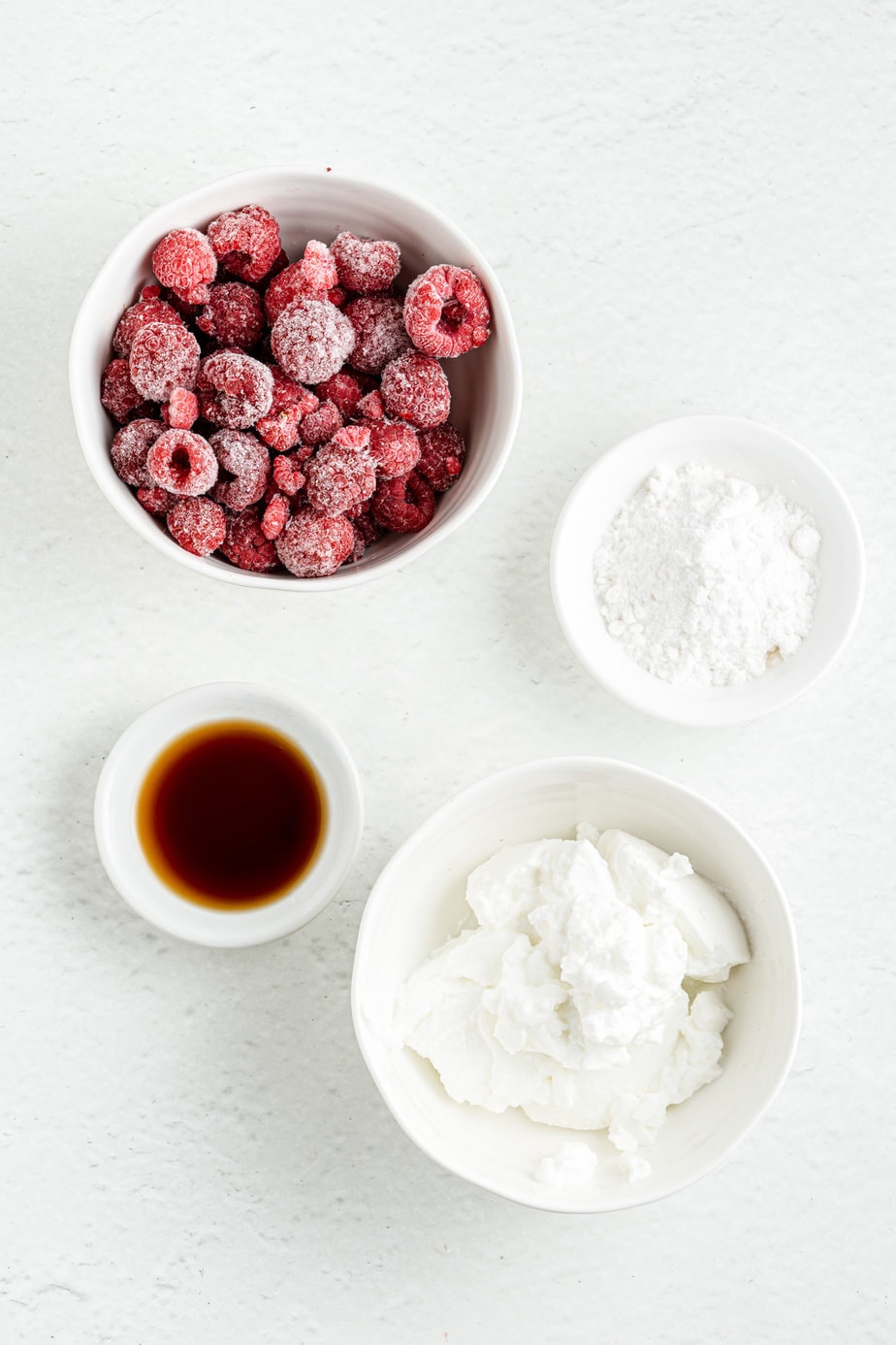 Ingredients for Raspberry Greek Yogurt popsicles - raspberries, Greek yogurt, vanilla, powdered sugar Swerve