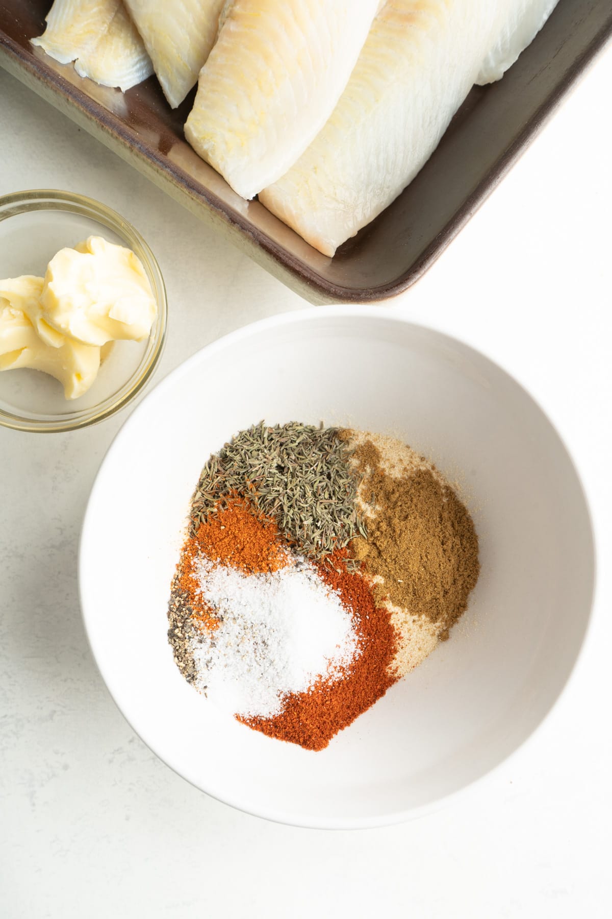 A bowl of ingredients for blackened fish seasoning.