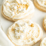 Frosted sour cream cookies with festive sprinkles.