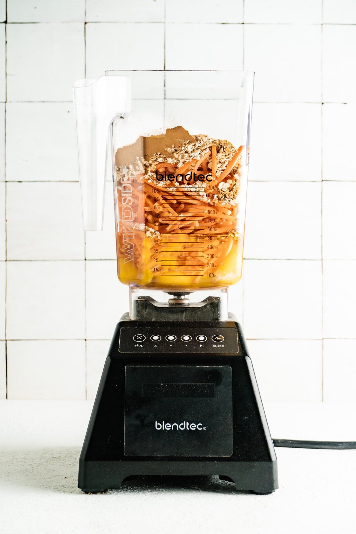 Ingredients for a carrot cake bread in a blender.