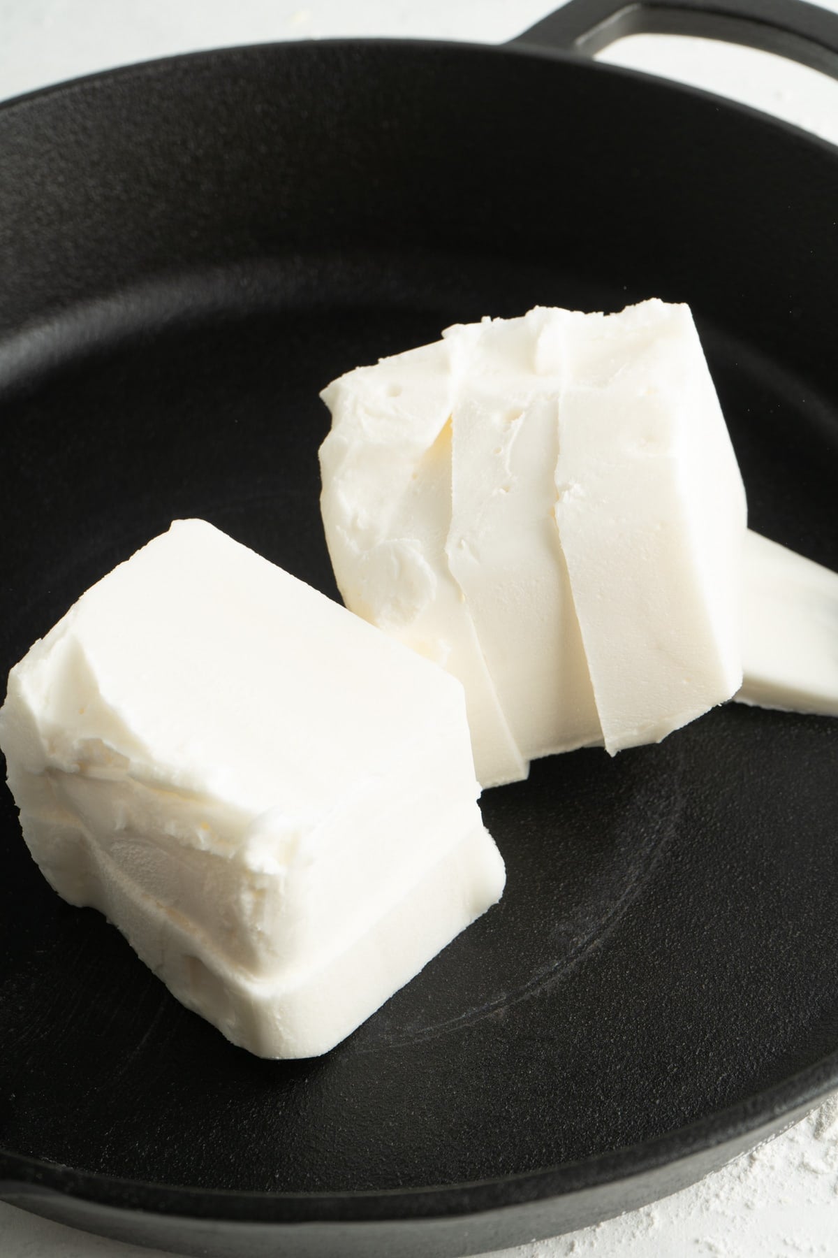 A cast iron skillet filled with lard.