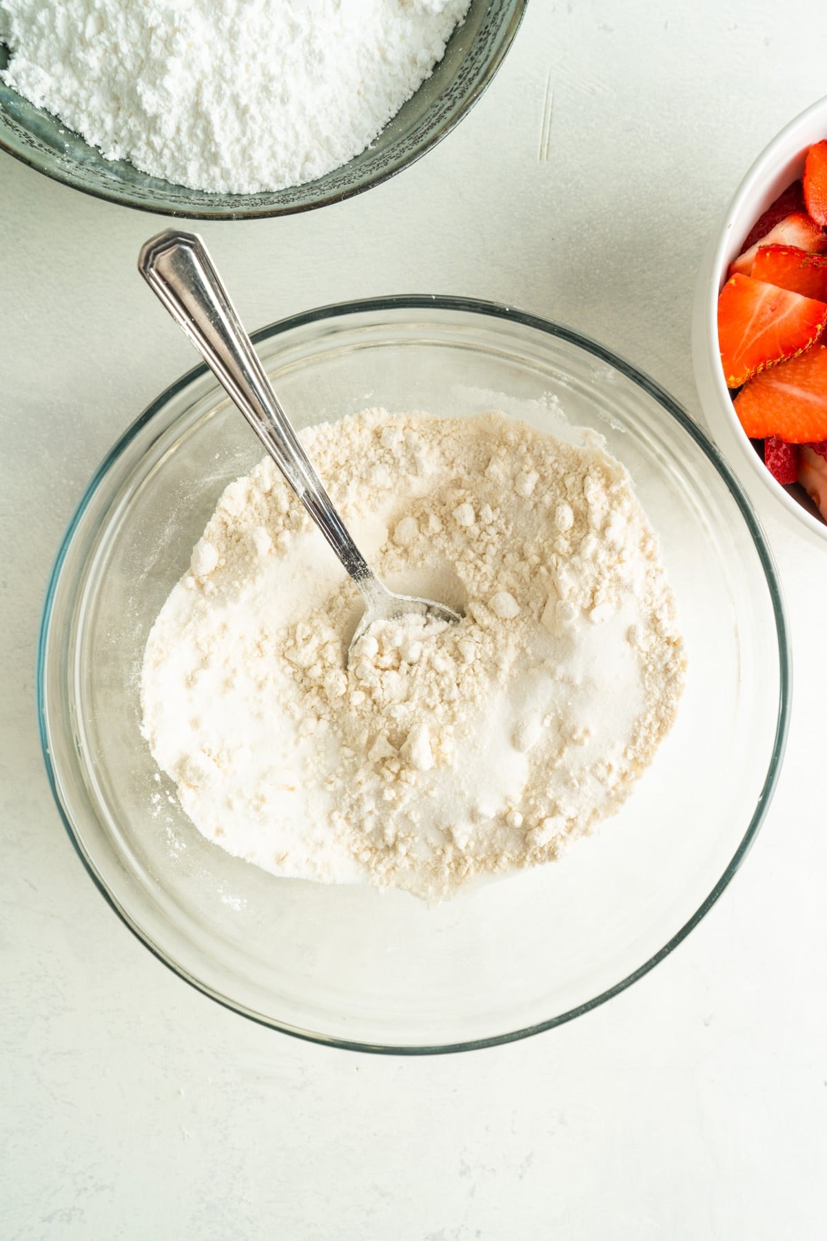 flour in a bowl with a spoon.