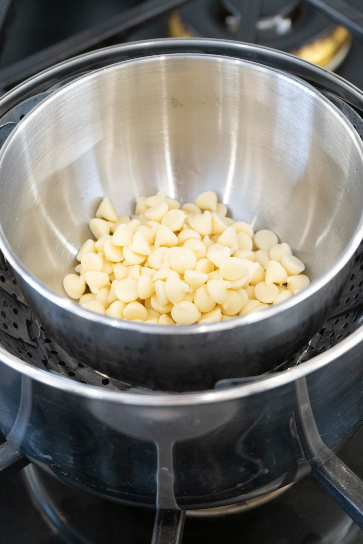 White chocolate being melted in a double boiler.