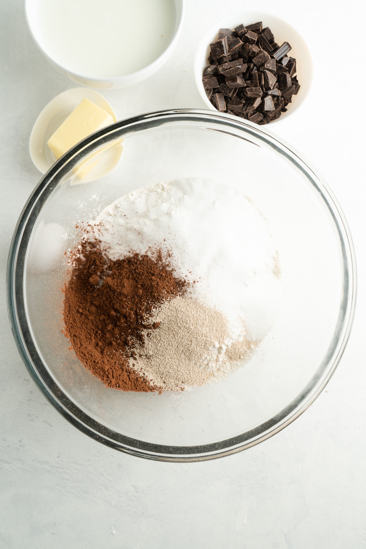 A bowl of sugar, flour, cocoa and spices.