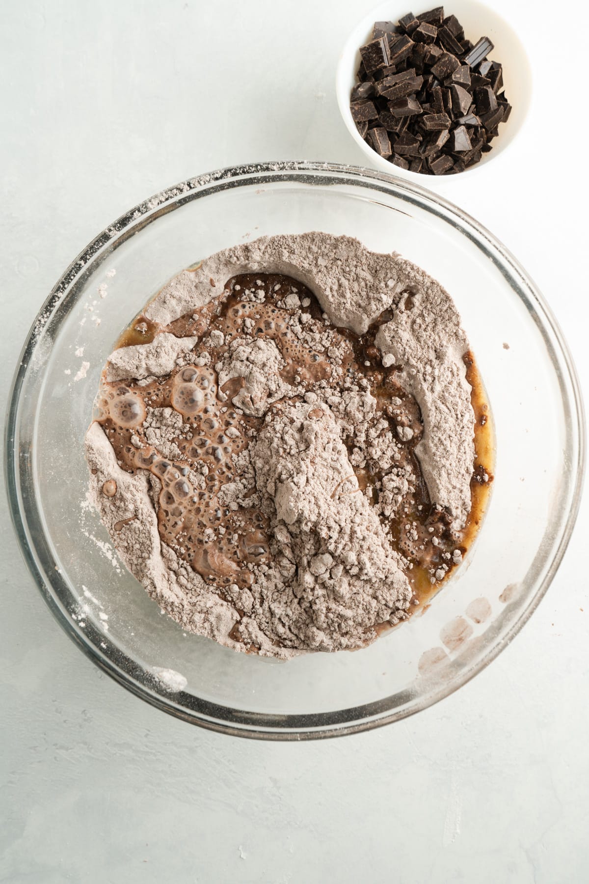A bowl of chocolate flour and wet ingredients.