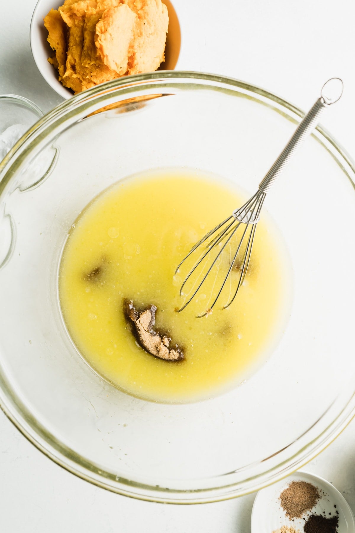 A bowl of eggs and sugar.