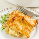A slice of a scalloped potatoes and ham recipe.