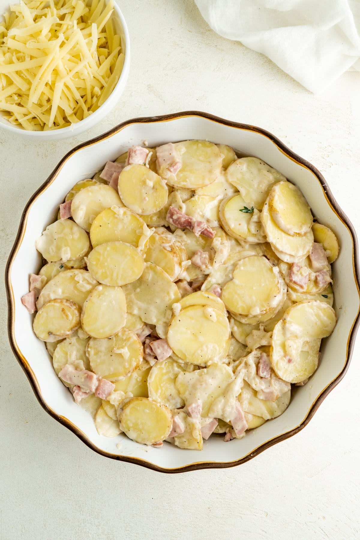 Potatoes and ham in a casserole dish.